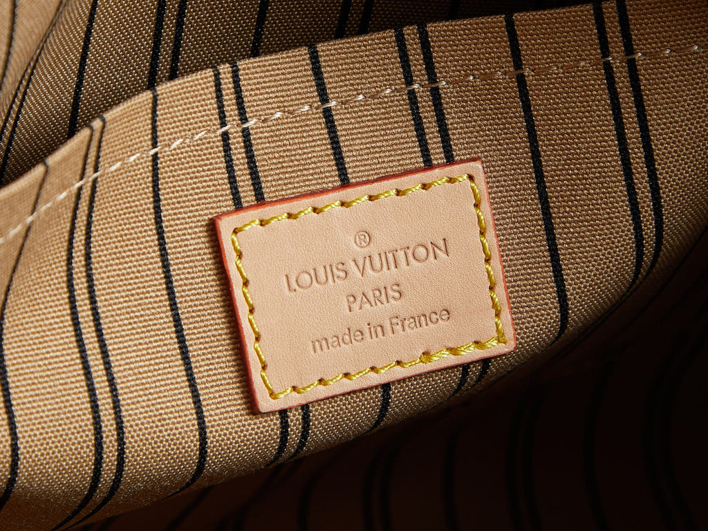 Louis Vuitton label on striped lining, 'made in France' tag.