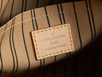 Louis Vuitton label on striped lining, 'made in France' tag.