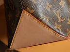 Louis Vuitton monogram corner with cream leather panel and multicolor stitching.