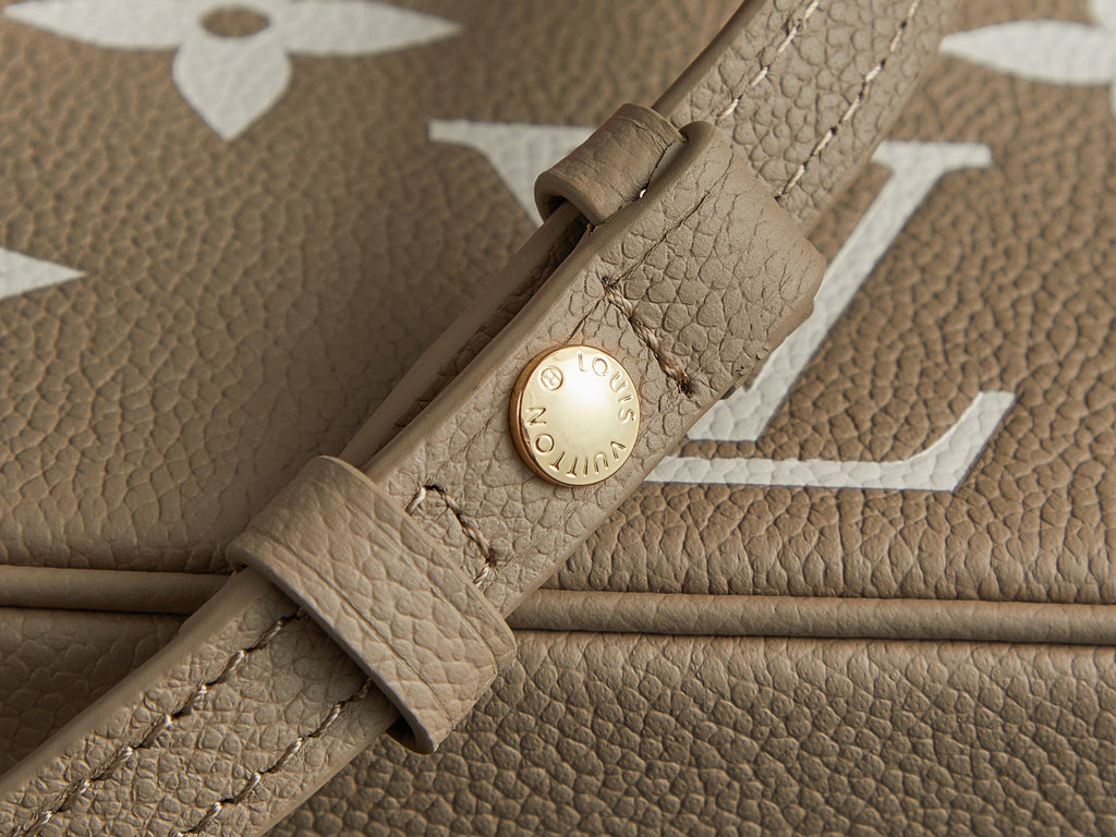 Louis Vuitton beige leather strap with round date-code tag and stitched details