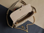 Louis Vuitton beige monogram crossbody bag interior with chain strap and open flap