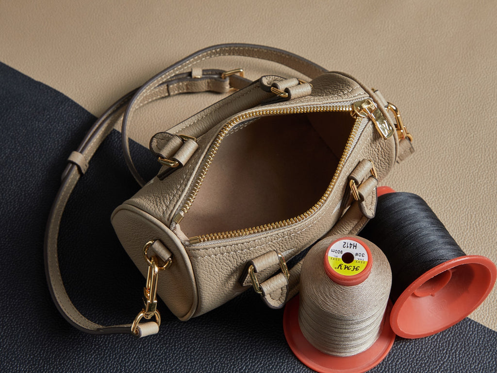 Louis Vuitton monogram handbag top view in beige with open zipper and gold hardware