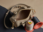 Louis Vuitton monogram handbag top view in beige with open zipper and gold hardware