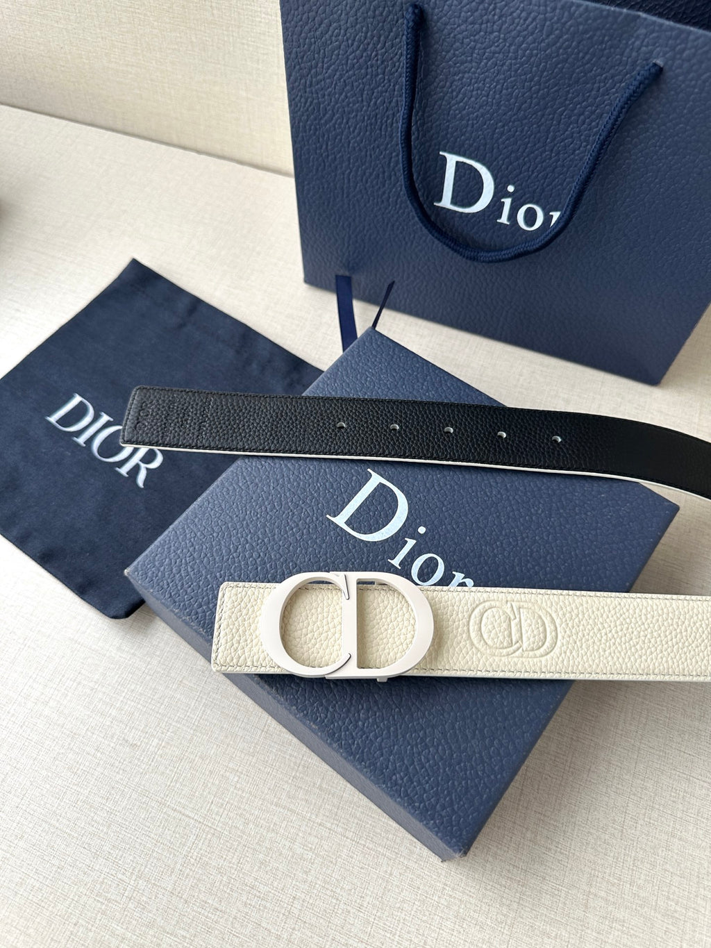 Dior belt with cream textured strap and logo buckle, stitched edge