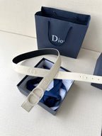 Dior belt with cream strap and logo buckle, adjustable holes visible