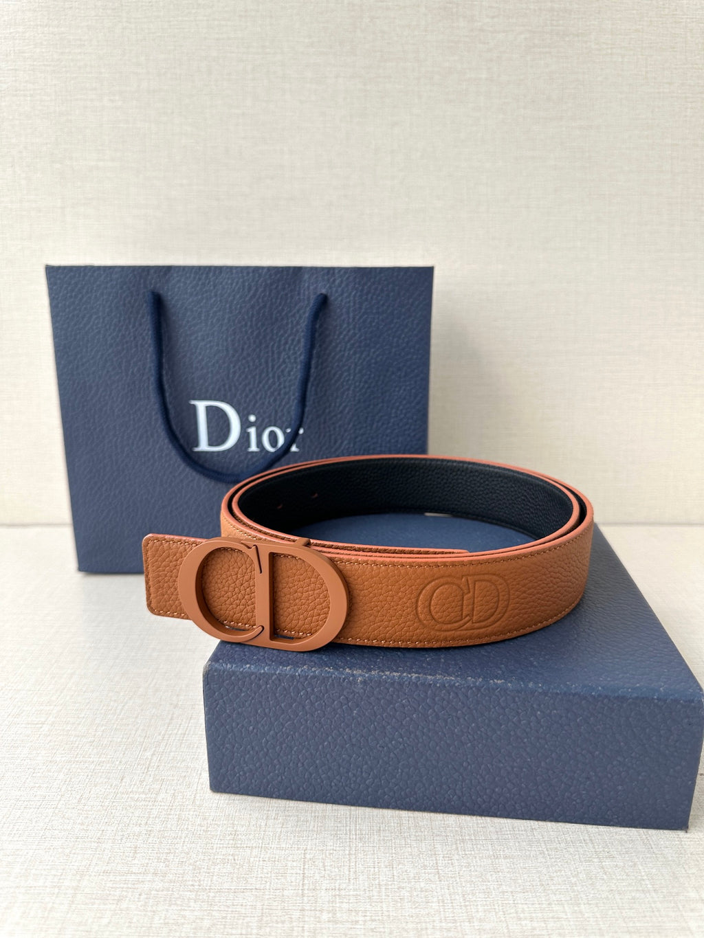 Tan-and-dark Dior belt with CD buckle and embossed leather strap
