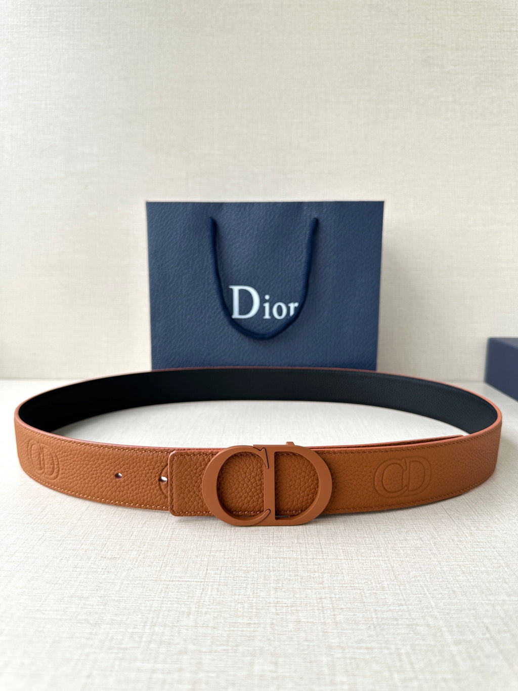 Dior belt in tan leather with CD logo buckle and embossed strap detail