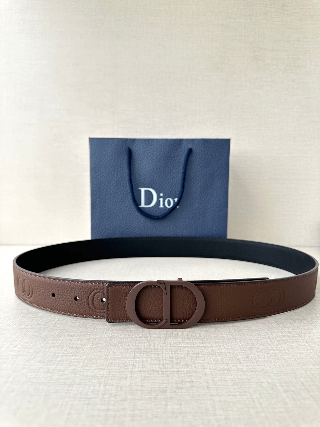 Dior brown leather belt with embossed buckle and adjustable hole strap