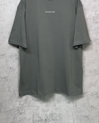 Balenciaga short-sleeve T-shirt, dark gray-green with small chest logo and straight hem.