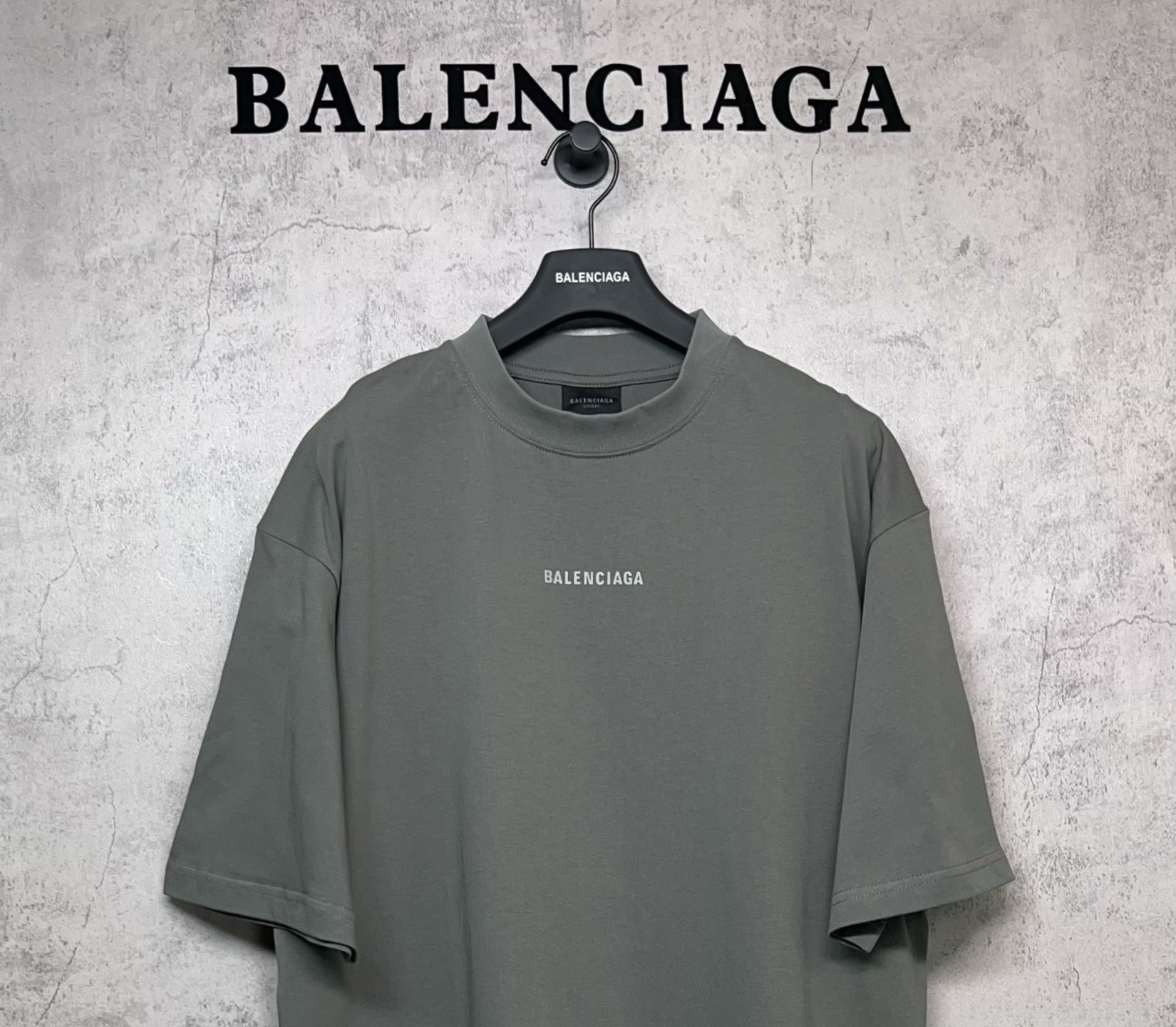 Balenciaga short-sleeve T-shirt with centered chest BALENCIAGA logo, dark gray-green.
