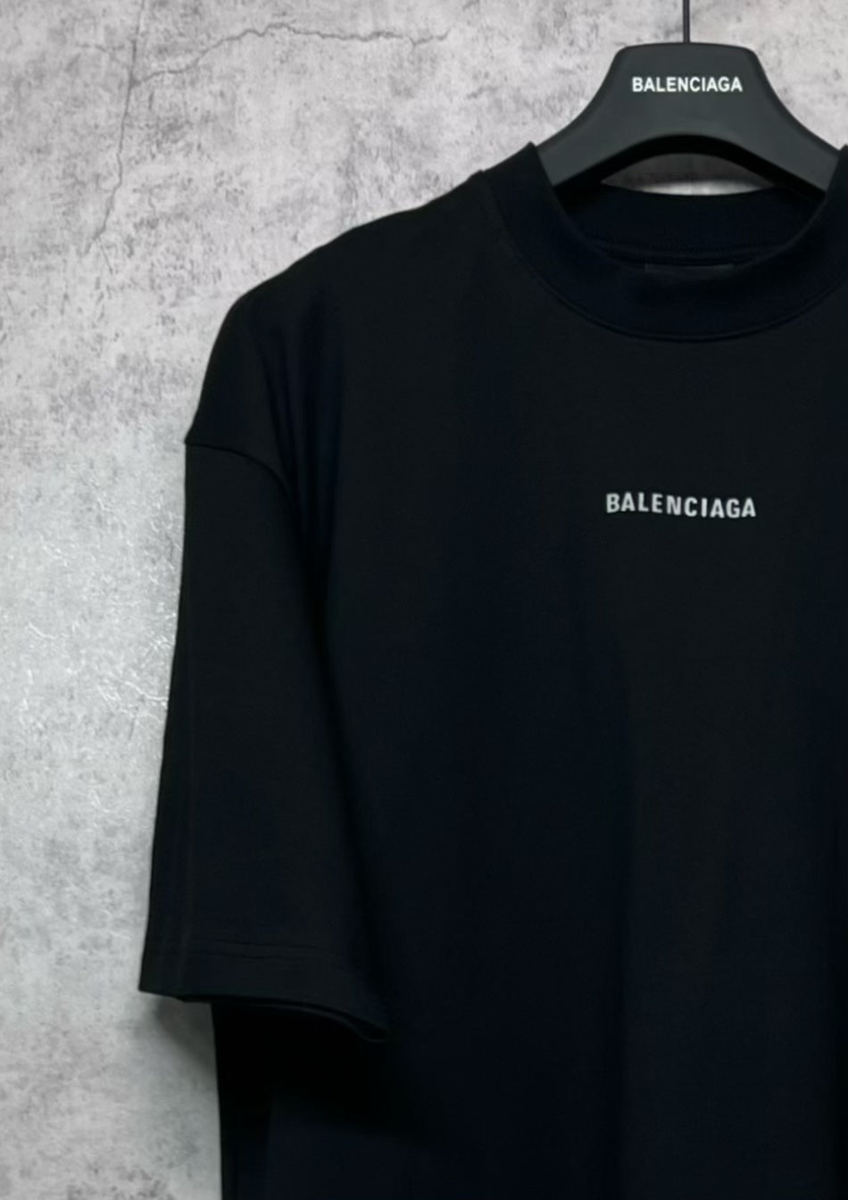 Black crewneck T-shirt with BALENCIAGA logo on chest, short sleeves