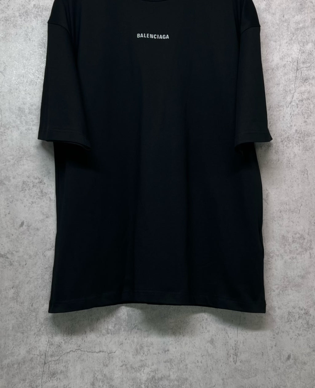 Black crewneck T-shirt with BALENCIAGA logo at center chest