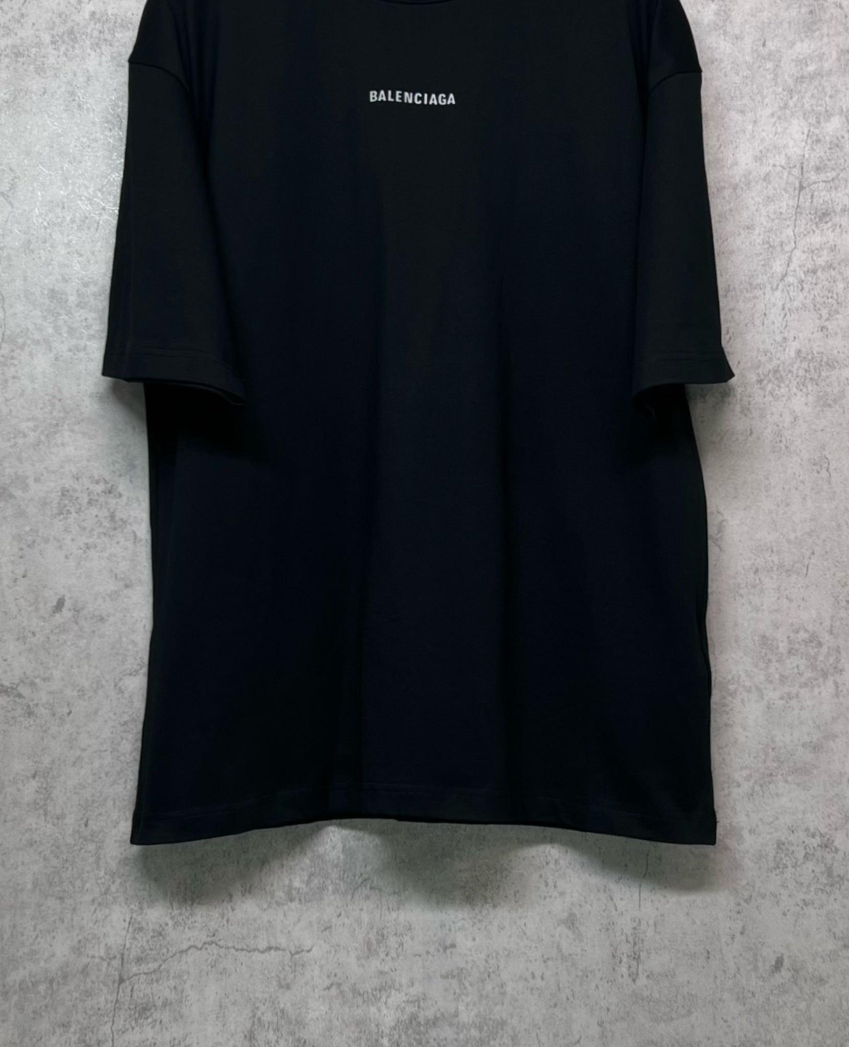 Black crewneck T-shirt with BALENCIAGA logo at center chest