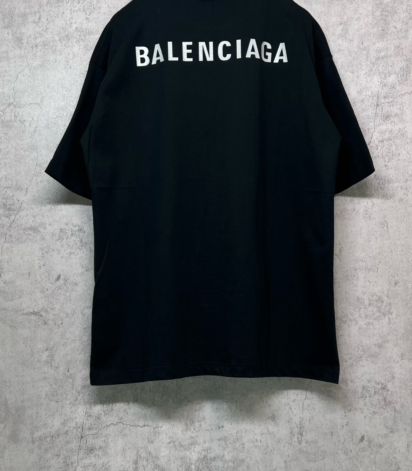 Black crewneck T-shirt with large BALENCIAGA logo across back