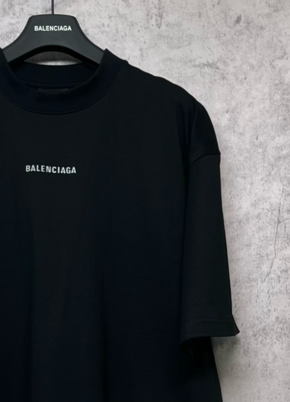 Black crewneck T-shirt with small BALENCIAGA logo on chest
