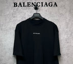 Black crewneck T-shirt with small BALENCIAGA logo on chest