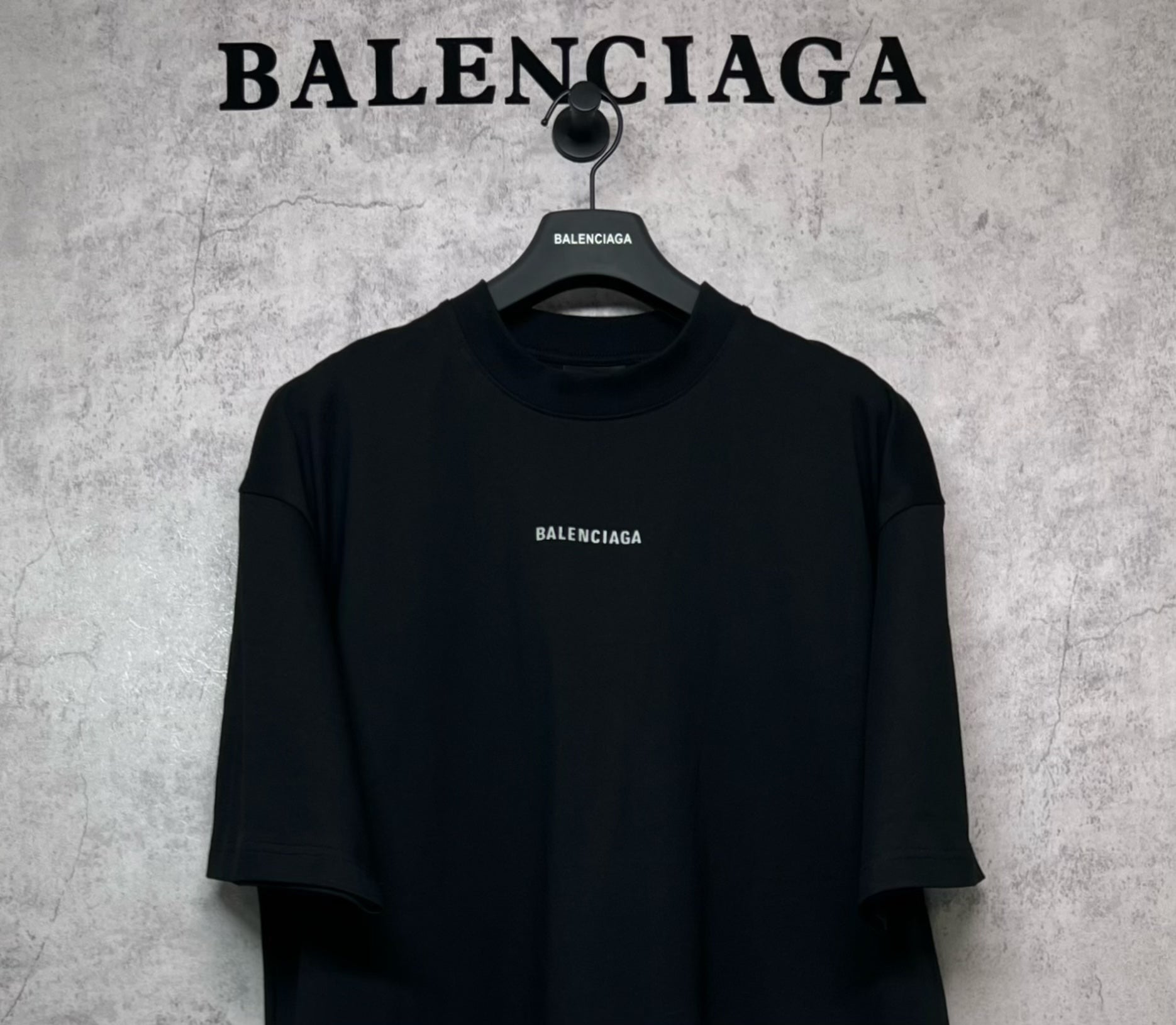 Black crewneck T-shirt with small BALENCIAGA logo on chest