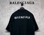 Black crewneck T-shirt with large BALENCIAGA logo across upper back