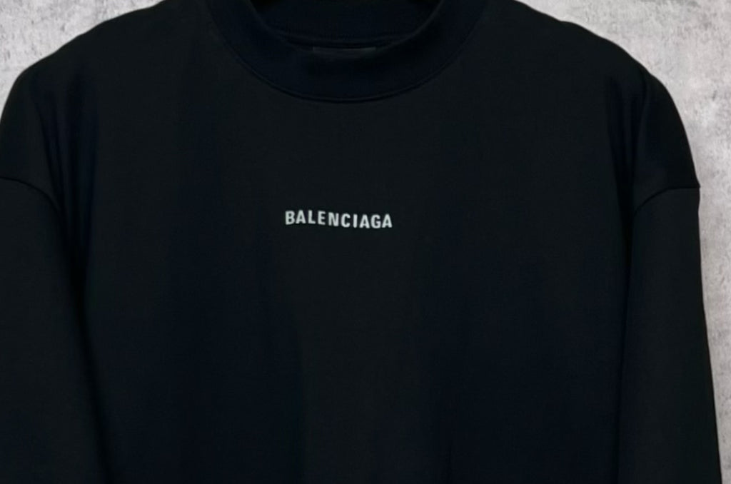 Black crewneck T-shirt with BALENCIAGA logo patch at upper chest