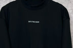 Black crewneck T-shirt with BALENCIAGA logo patch at upper chest