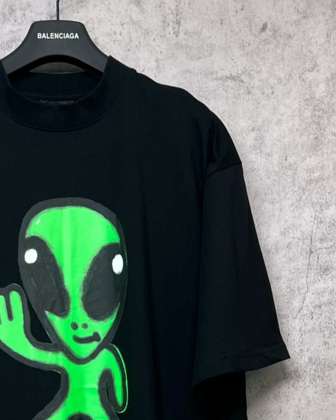 Balenciaga short-sleeve T-shirt, black with neon green alien face graphic on front