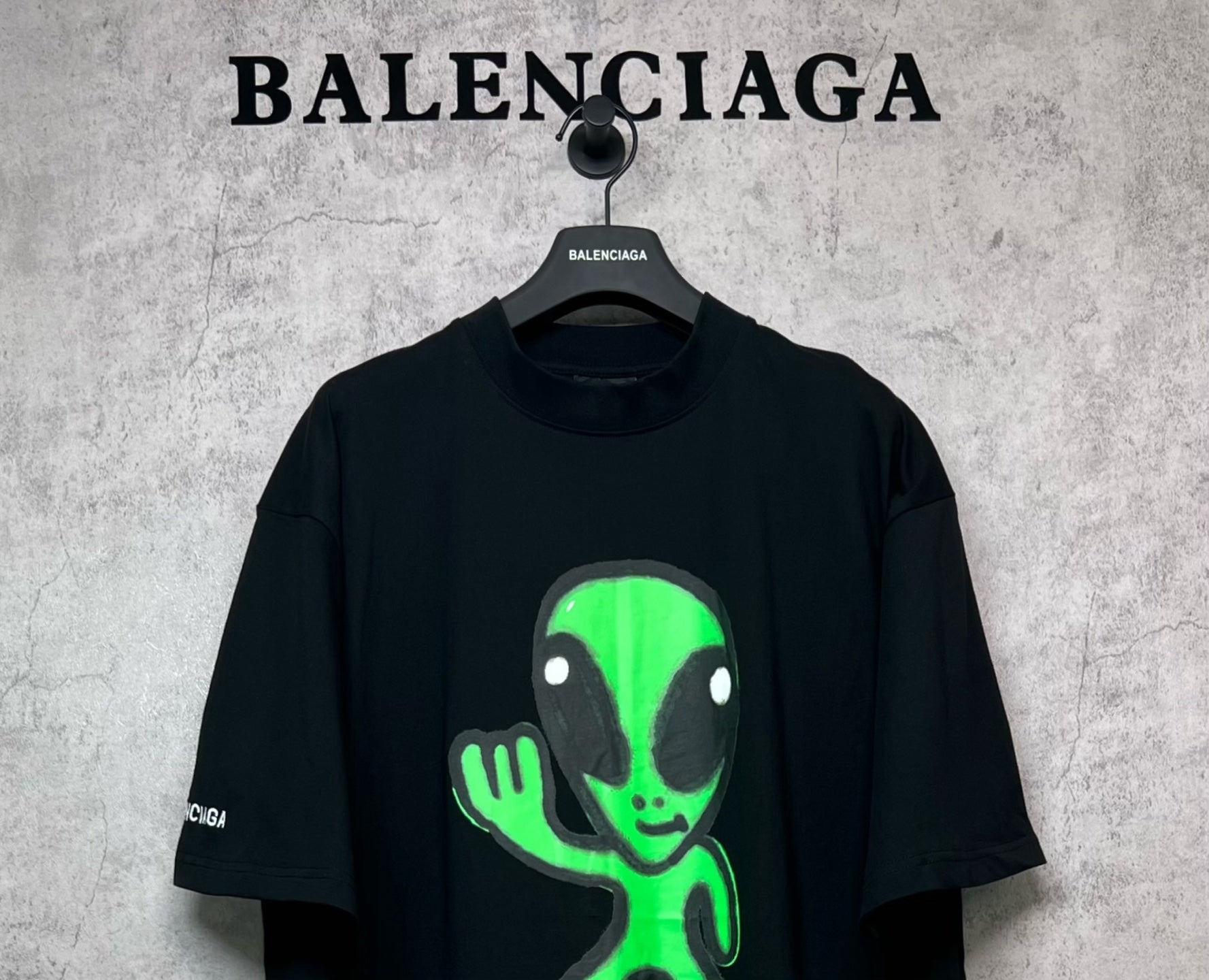 Balenciaga short-sleeve T-shirt, black with neon green alien face graphic on front