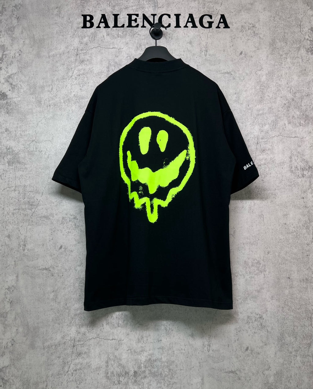 Balenciaga short-sleeve T-shirt, black with neon green alien skull graphic on back