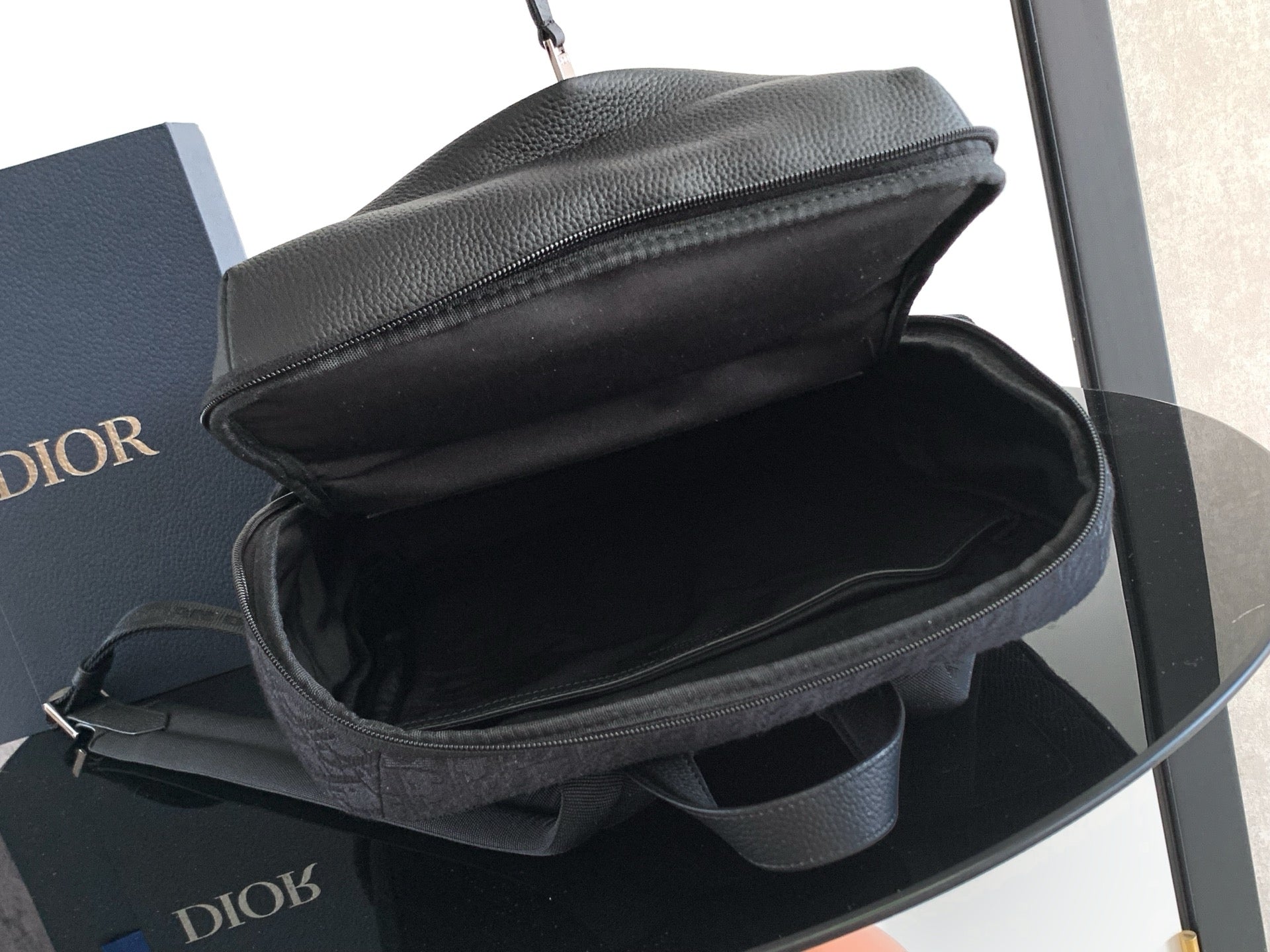 Dior monogram backpack open top with visible interior lining