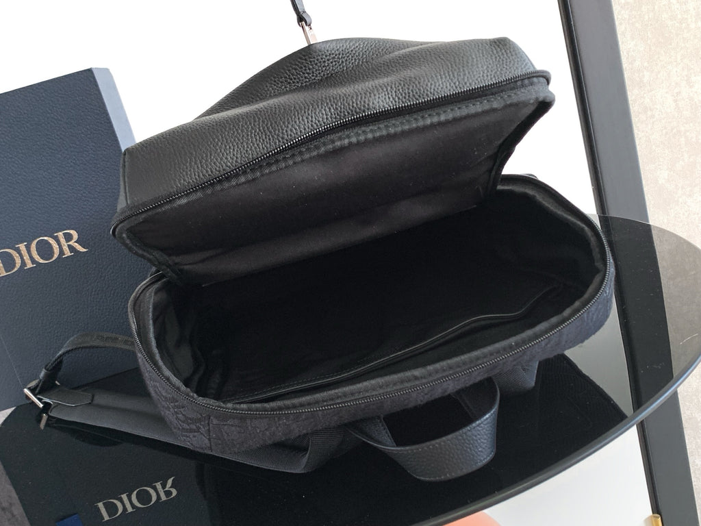Dior monogram bag interior with zippered top and side strap