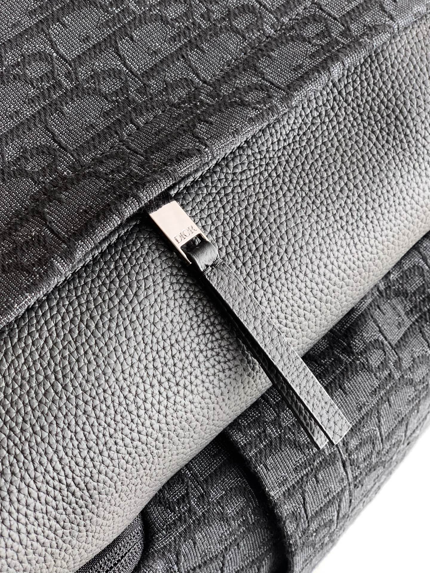 Backpack lining close-up with zipper trim and stitched fabric panel