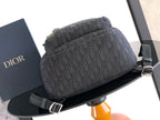 Men's Dior monogram backpack with zippered top and front strap detail