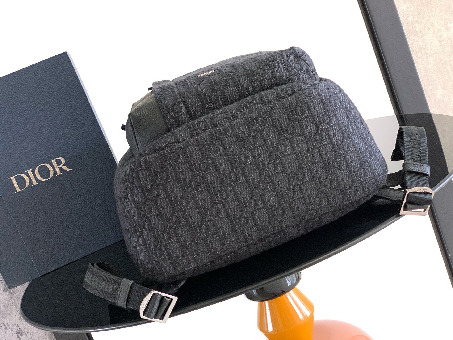 Men's Dior monogram backpack with zippered top and front strap detail