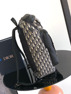Dior men’s monogram backpack with front pocket and two webbing shoulder straps