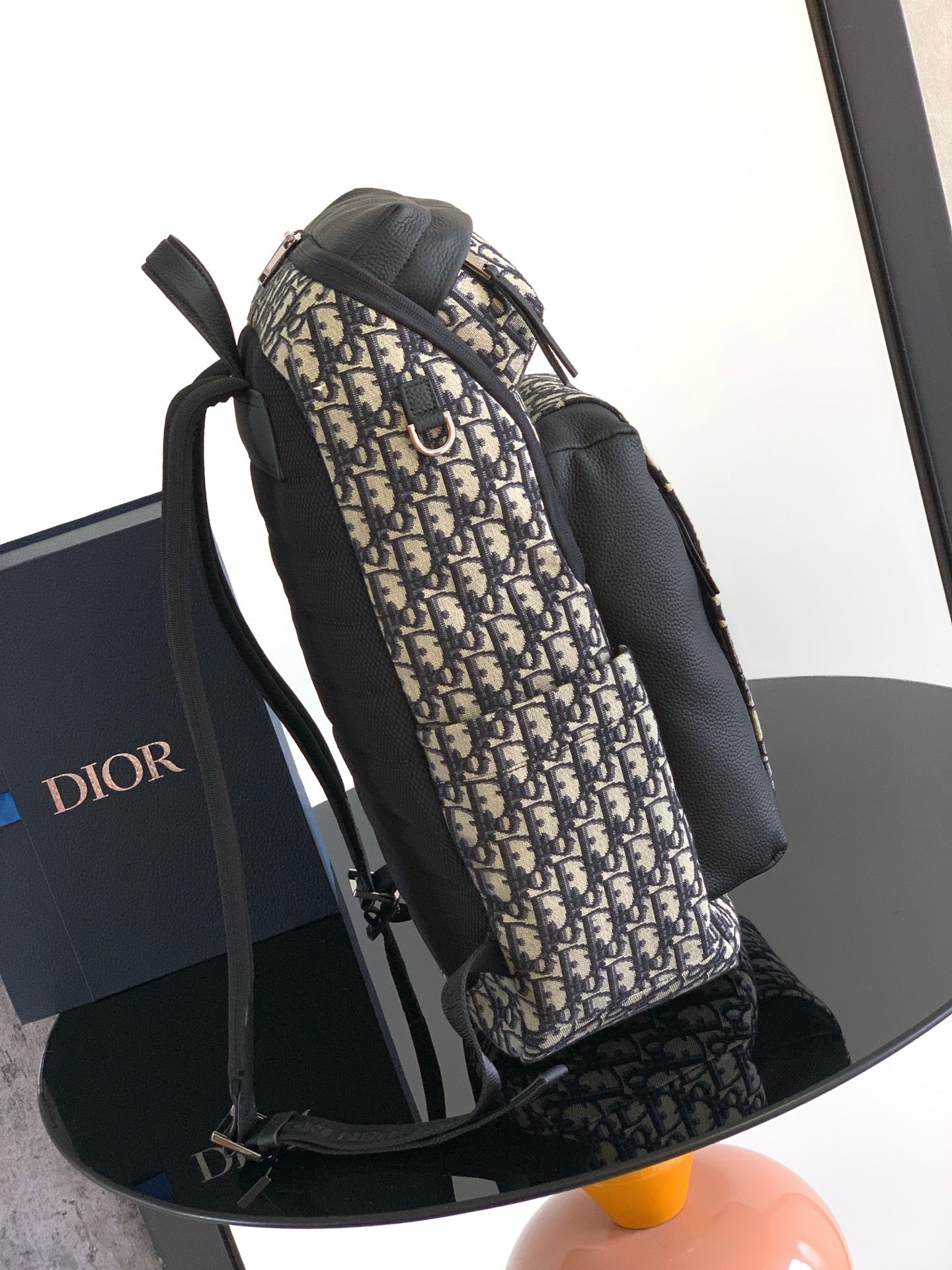 Dior men’s monogram backpack with front pocket and two webbing shoulder straps