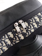 Black leather backpack panel with Dior monogram print and silver-tone zipper pulls