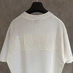 White Balenciaga T-shirt with large embossed BALENCIAGA logo across the back