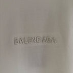 White Balenciaga T-shirt fabric close-up of BALENCIAGA logo embroidery