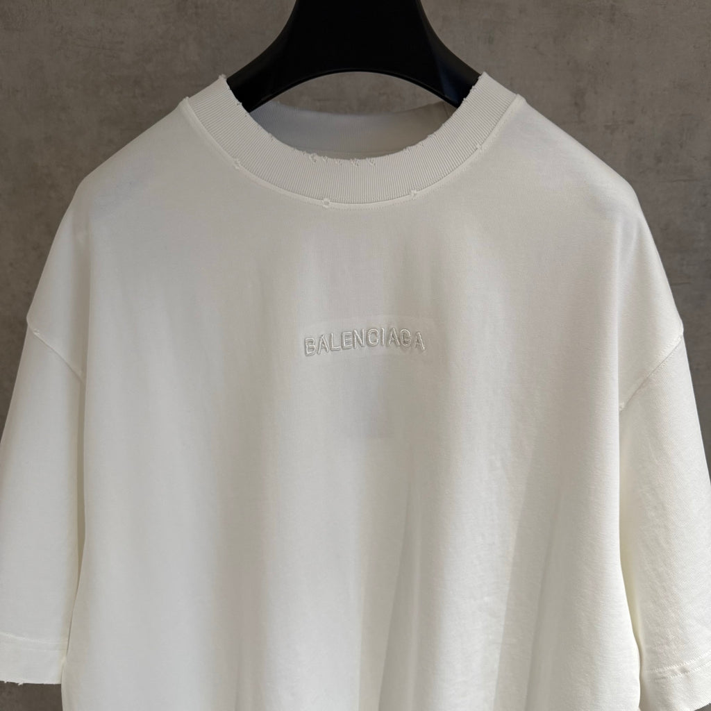 White Balenciaga T-shirt close-up of small chest BALENCIAGA logo on crew neck