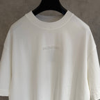 White Balenciaga T-shirt close-up of small chest BALENCIAGA logo on crew neck