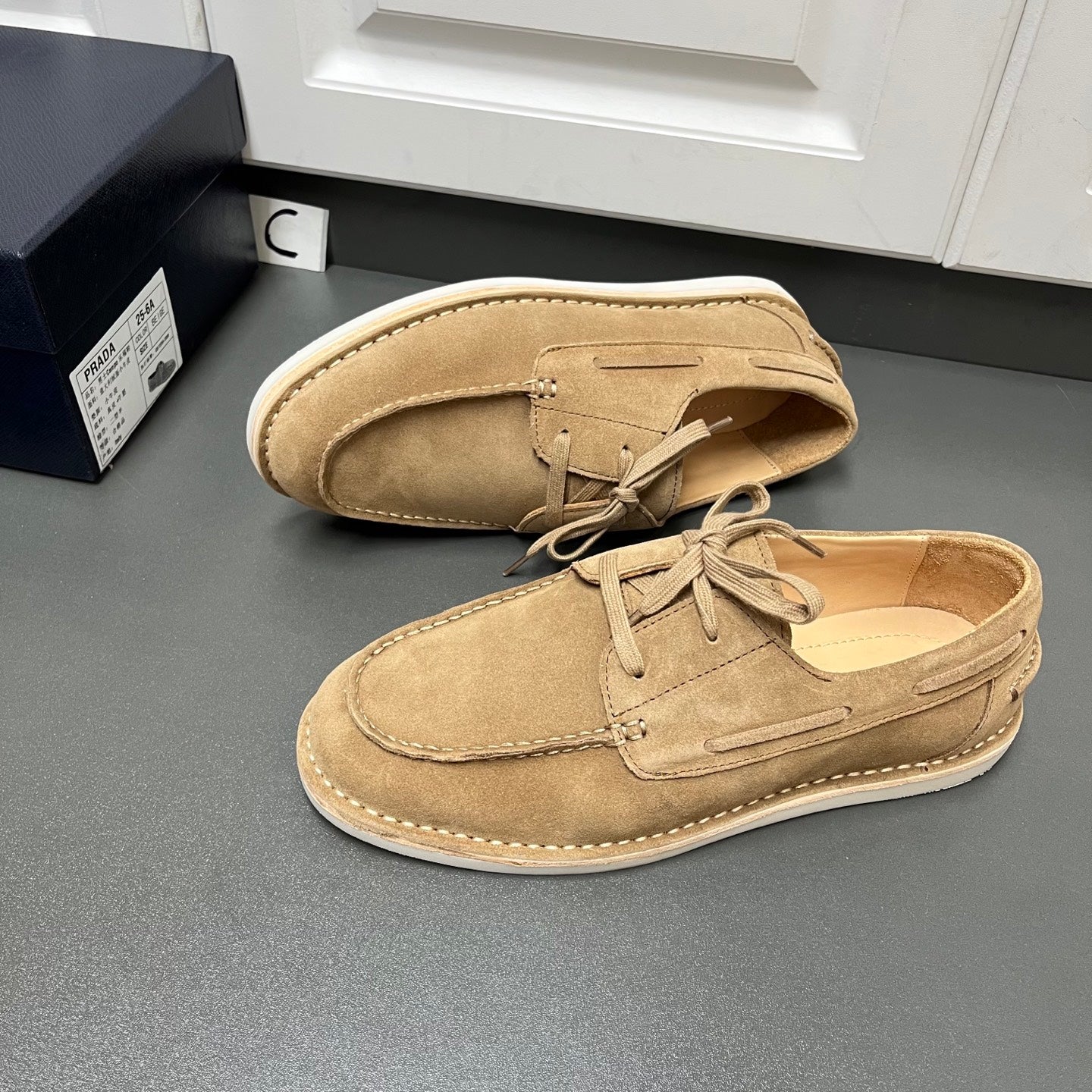 Prada unisex tan suede lace-up shoes, side view with contrast welt stitching