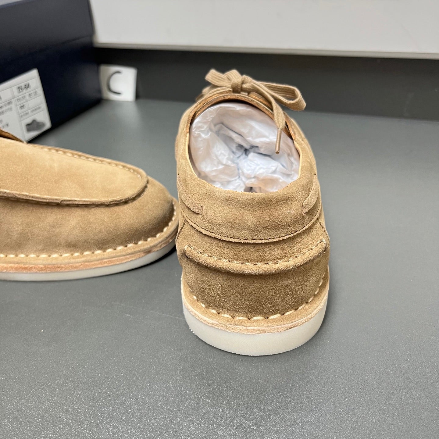 Prada unisex tan suede shoes, heel view with lace-up detail