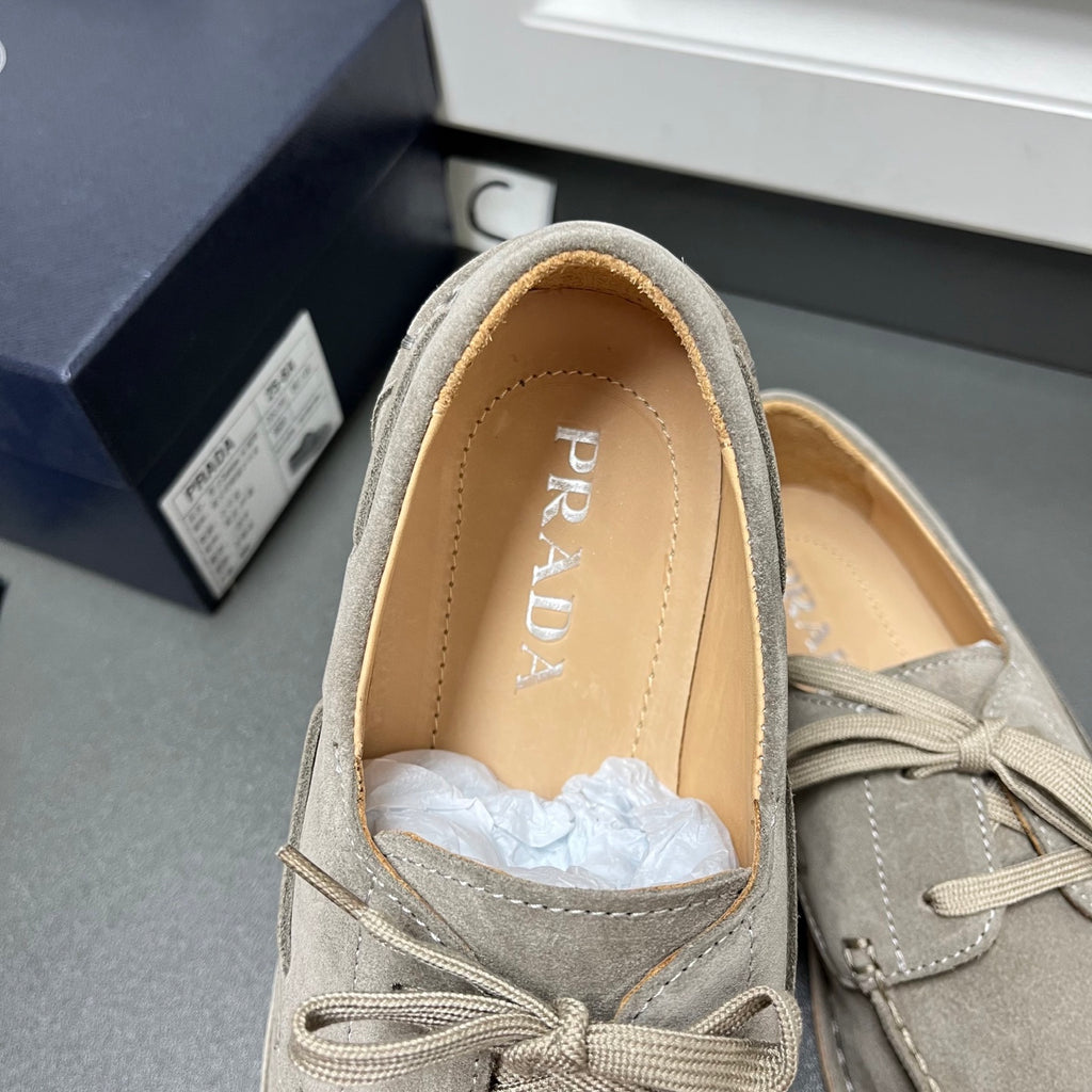 Prada unisex suede lace-up shoes in light gray, interior with PRADA logo