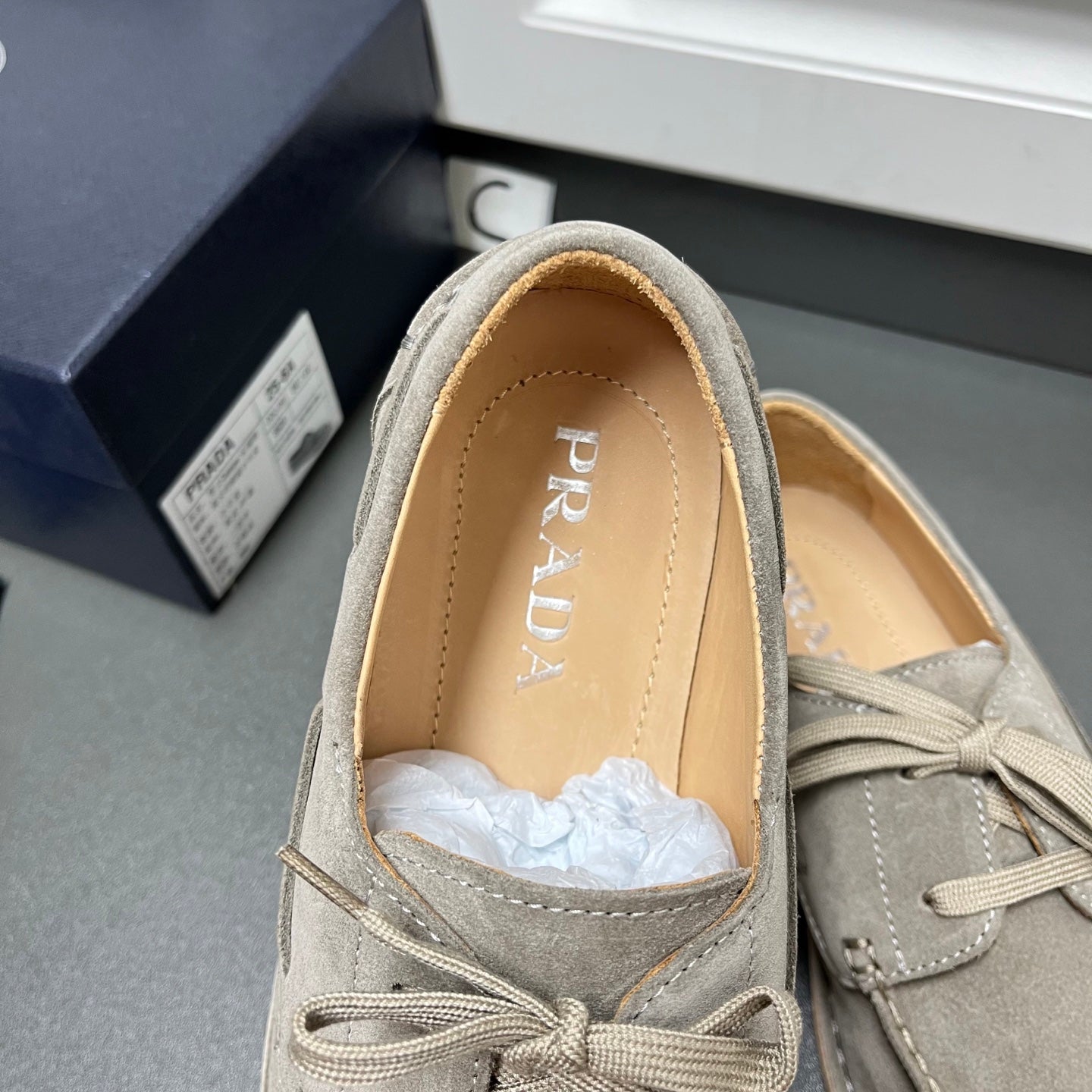 Prada unisex suede lace-up shoes in light gray, interior with PRADA logo