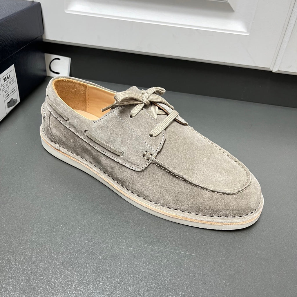 Prada unisex suede lace-up shoes in light gray, three-quarter front view