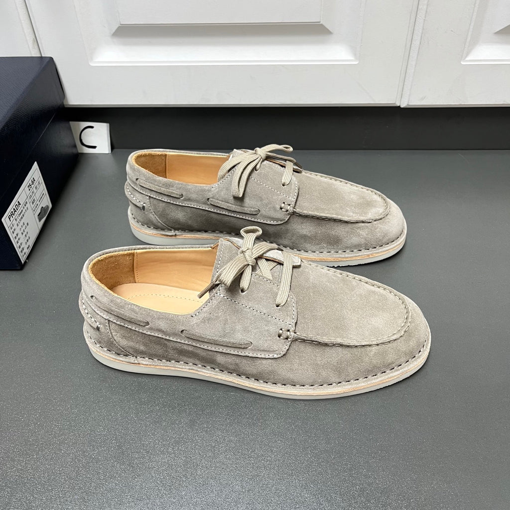 Prada unisex suede lace-up shoes in light gray, two-shoe front angle