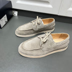 Prada unisex suede lace-up shoes in light gray, side-by-side view