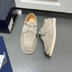 Prada unisex suede lace-up shoes in light gray, front view, cream sole