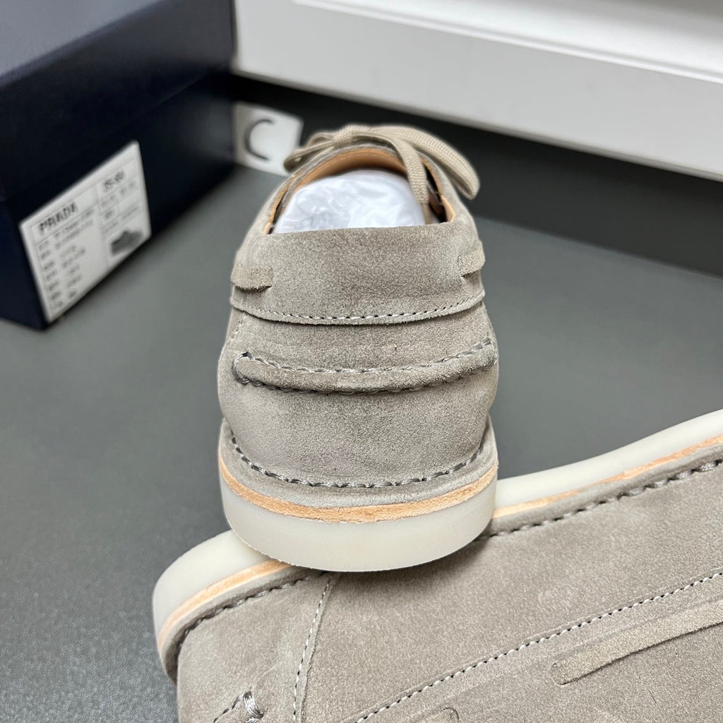 Prada unisex suede lace-up shoes in light gray, heel back view close-up