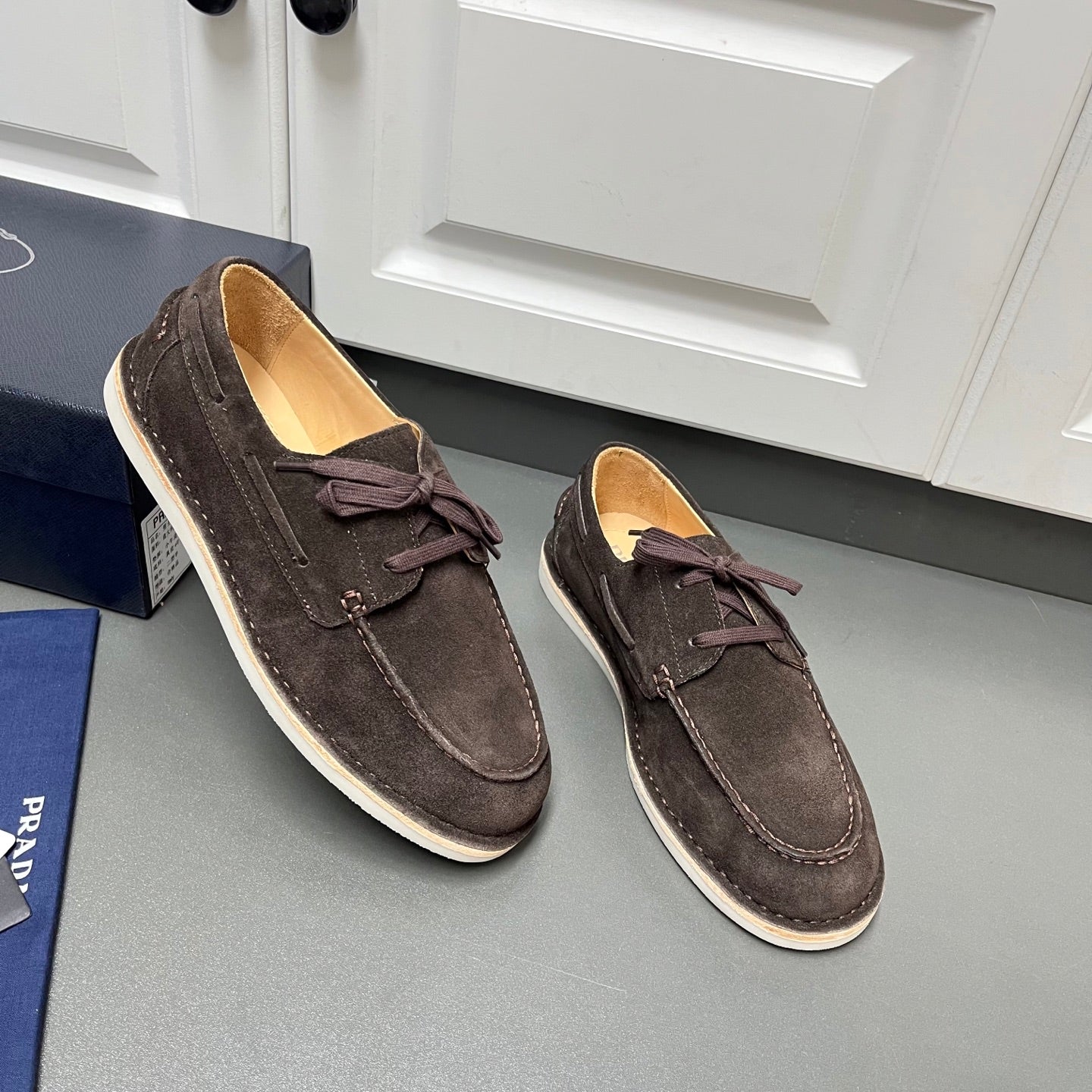 Prada unisex suede shoes, dark brown with lace bow, white-striped sole trim