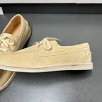 Beige suede lace-up loafer with textured seam detailing and flat white sole